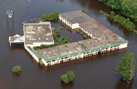 A building sits in floodwater caused by Hurricane Florence, in this aerial picture, in Lumberton, North Carolina, U.S. September 17, 2018. REUTERS/Jason Miczek