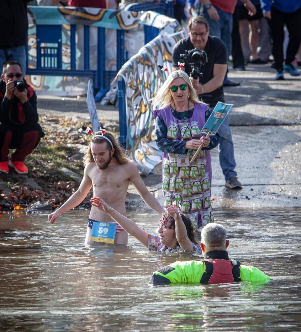 From front to back, Jenavieve, Forrest and columnist Kristi K. Higgins participate in the 2024 Richmond Polar Plunge at Pocahontas State Park to raise money for Special Olympics.