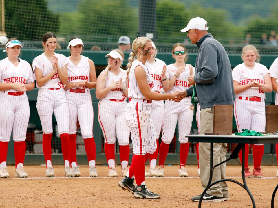 Addison Grosse gets her runner-up medal from athletic director Lance Dupler following Sheridan's 2-1 loss to Circleville Logan Elm in a Division II district final on Friday at Ohio University.