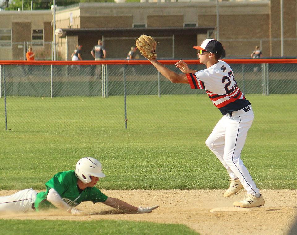 Second baseman Cayden Masching reaches for the ball as Eureka's Austin Wiegand tries to get back to the second base bag. Masching made the catch of the throw from PTHS third baseman Drew Wayman to complete the double play in Wednesday's nonconference game at The Ballpark at Williamson Field.