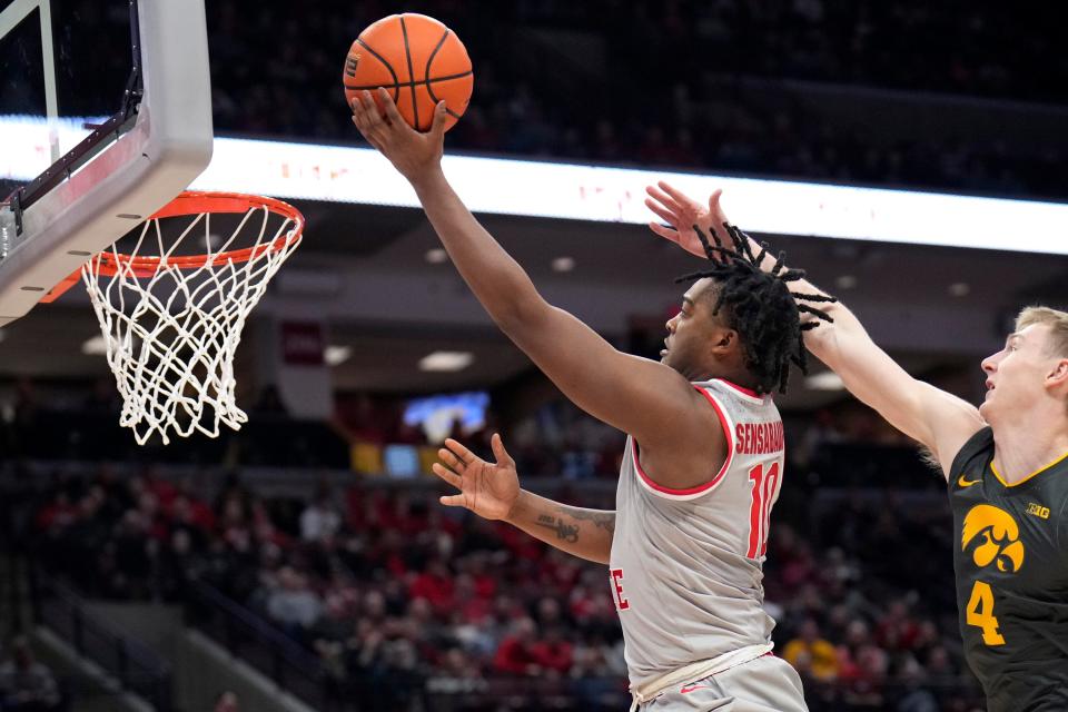 Jan 21, 2023; Columbus, OH, USA;  Ohio State Buckeyes forward Brice Sensabaugh (10) scores while defended by Iowa Hawkeyes guard Josh Dix (4) during the second half of the NCAA division I men’s basketball game between the Ohio State Buckeyes and the Iowa Hawkeyes at Value City Arena. Mandatory Credit: Joseph Scheller-The Columbus Dispatch