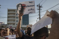 Protesters gather in Sulaimaniyah on Sept. 28, 2022, protest the killing of Mahsa Amini, an Iranian Kurdish woman after she was arrested in Tehran by morality police for wearing her headscarf improperly. Iran has accused Kurdish opposition groups in exile of orchestrating the wave of protests across the country over the past two weeks. But Kurdish activists say the government is just trying to scapegoat them to distract from the domestic anger fueling the unrest. (AP Photo/Hawre Khalid, Metrography)