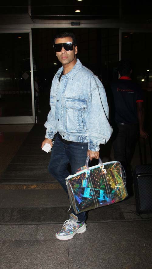 Karan Johar sports a colour changing bag that costs more than Rs 7