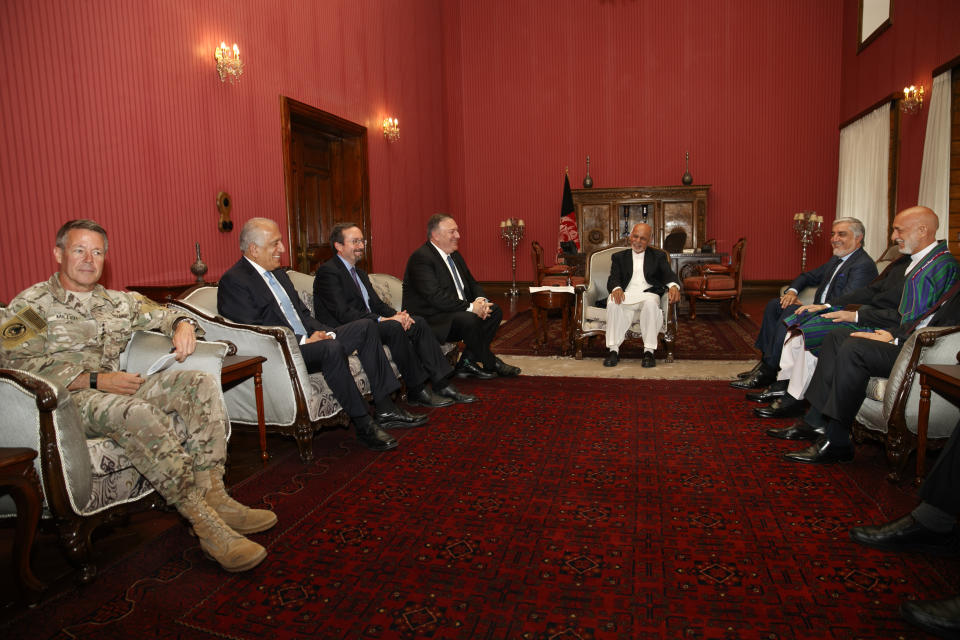 Secretary of State Mike Pompeo meets with, from left, Resolute Support NATO Base Commander Gen. Austin Scott Miller, Afghanistan Envoy Zalmay Khalilzad, U.S. Ambassador to Afghanistan John Bass, Pompeo, Afghan President Ashraf Ghani, Afghan Chief Executive Abdullah Abdullah, and former Afghan President Hamid Karzai, Tuesday, June 25, 2019, during an unannounced visit to Kabul, Afghanistan. (AP Photo/Jacquelyn Martin, Pool)