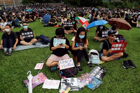 People take part in a general strike at Tamar Park in Hong Kong