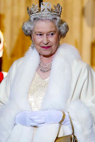 <p>Pool Photograph/Corbis/Corbis via Getty</p> Queen Elizabeth stopped wearing real fur — except for ceremonial wear — in 2019