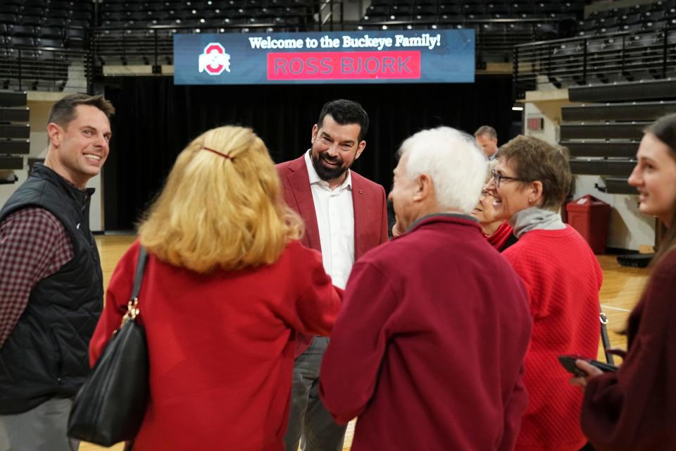 Jan 17, 2024; Columbus, OH, USA; Ohio State Buckeyes football coach Ryan Day speaks to family members of new athletic director Ross Bjork following a press conference to name the university’s new athletic director at the Covelli Center.