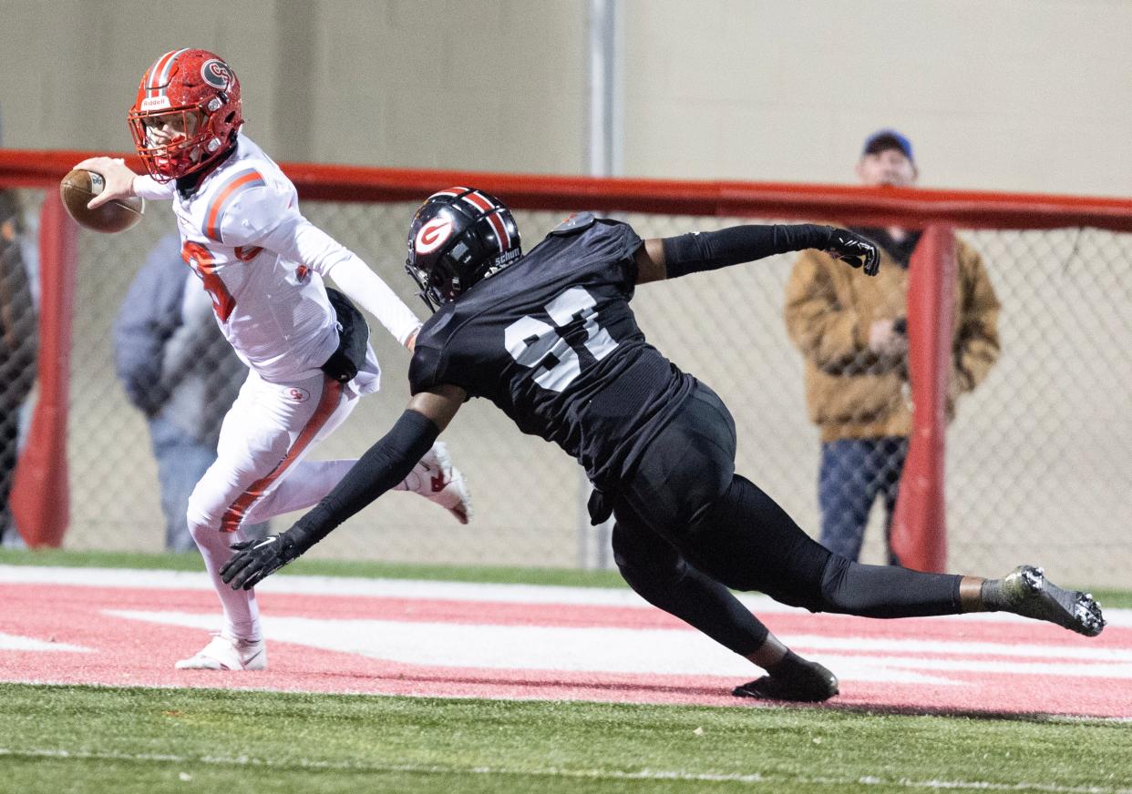 Canton South quarterback Poochie Snyder eludes a Glenville defender in a state semifinal, Friday, Nov. 24, 2023, in Wadsworth.