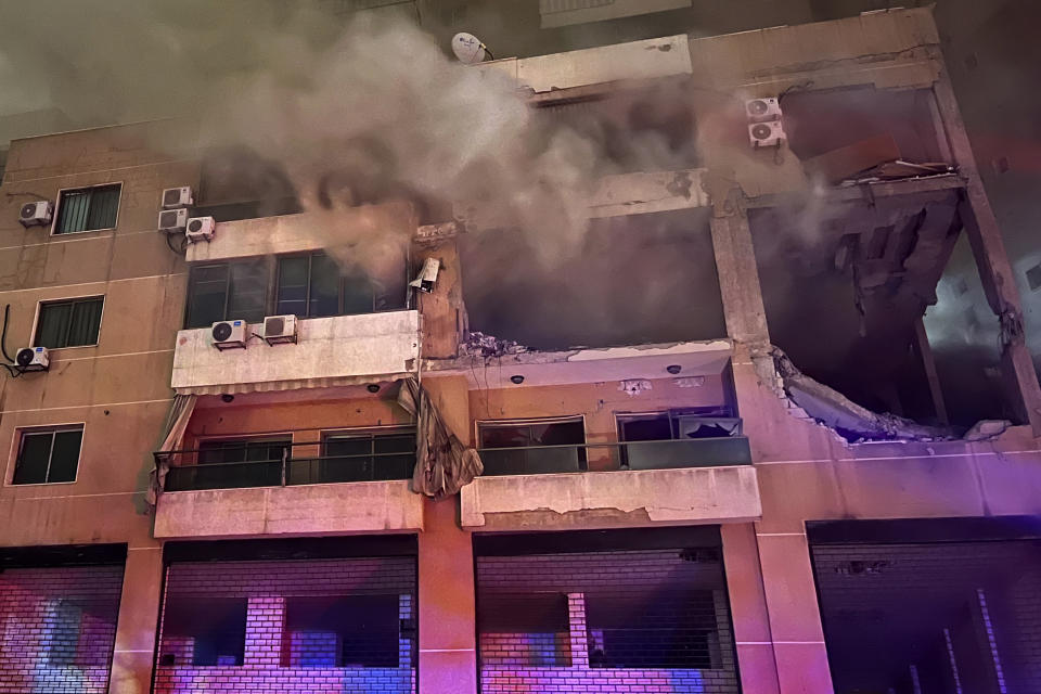 Smoke rises from a destroyed apartment as following a massive explosion in the southern suburb of Beirut, Lebanon, Tuesday, Jan. 2, 2024. The TV station of Lebanon's Hezbollah group says top Hamas official Saleh Arouri was killed Tuesday in an explosion in a southern Beirut suburb. (AP Photo/Hussein Malla)