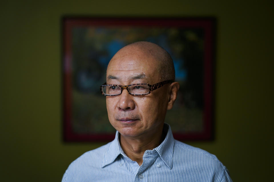 Jerry Cheng poses for a photograph in Philadelphia, Friday, Nov. 4, 2022. The retired mechanical engineer cherishes his ability to participate in democracy...and especially his freedom to criticize politicians. (AP Photo/Matt Rourke)