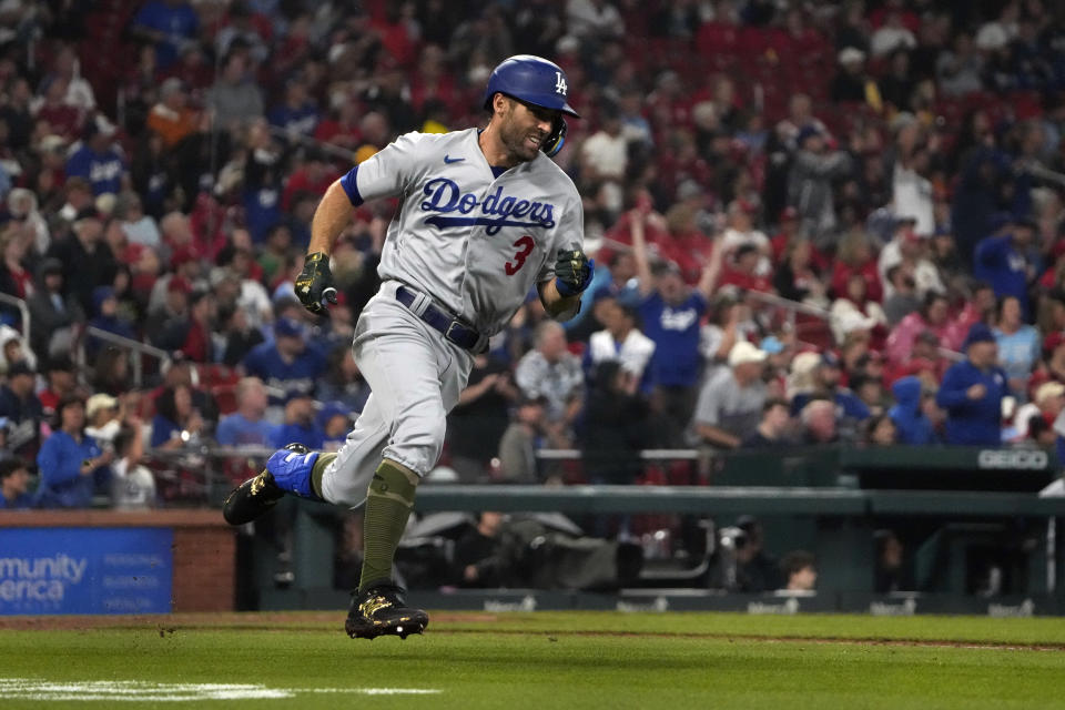 Los Angeles Dodgers' Chris Taylor rounds first on his way to an RBI double during the fifth inning of a baseball game against the St. Louis Cardinals Friday, May 19, 2023, in St. Louis. (AP Photo/Jeff Roberson)