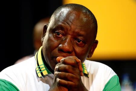 Deputy president of South Africa Cyril Ramaphosa reacts after he was elected president of the ANC during the 54th National Conference of the ruling African National Congress (ANC) at the Nasrec Expo Centre in Johannesburg, South Africa December 18, 2017. REUTERS/Siphiwe Sibeko/Files