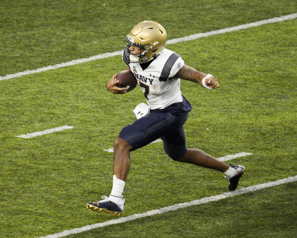 Navy quarterback Xavier Arline runs with the ball during an NCAA college football game against Cincinnati, Saturday, Nov. 5, 2022, in Cincinnati. (AP Photo/Jeff Dean)