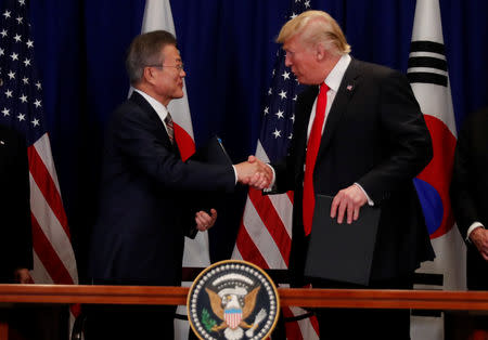 South Korean President Moon Jae-in shakes hands with U.S. President Donald Trump after they signed the U.S.-Korea Free Trade Agreement on the sidelines of the 73rd United Nations General Assembly in New York, U.S., September 24, 2018. REUTERS/Carlos Barria