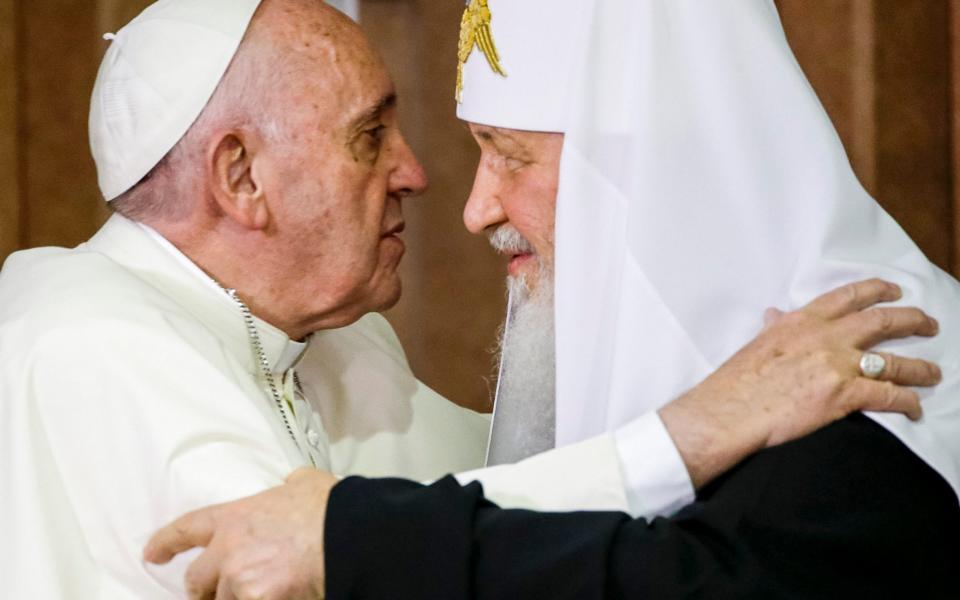 Pope Francis, left, reaches to embrace Russian Orthodox Patriarch Kiril - AP Photo/Gregorio Borgia, Pool