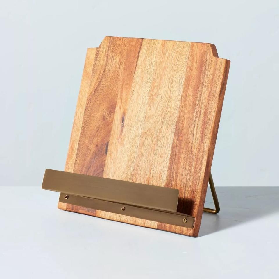 Wooden cookbook stand with an angled panel and brass accents