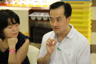 People's Action Party candidate Koh Poh Koon speaks to residents at Rivervale Mall during a walkabout on Sunday, 13 January. (Yahoo! photo)