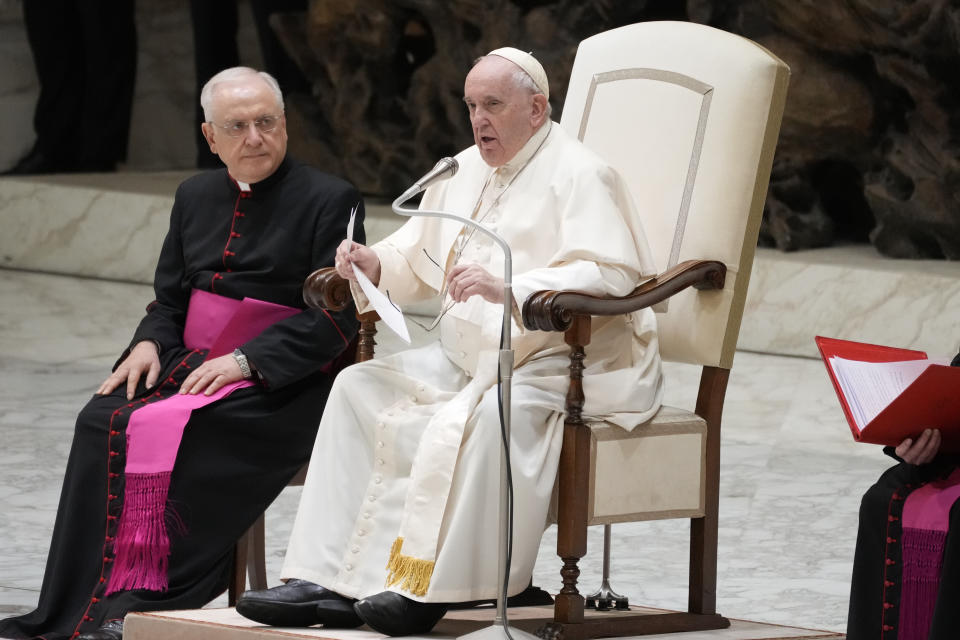 Pope Francis talks during an audience with Vatican's employees in the Paul VI Hall, at the Vatican, Thursday, Dec. 22, 2022. (AP Photo/Andrew Medichini)