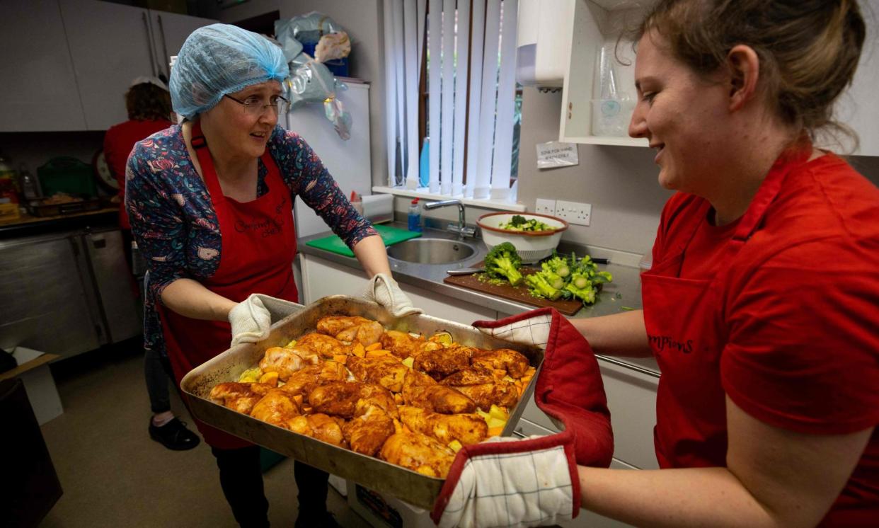 <span>People preparing free meals for vulnerable families at a London food bank during Covid. The HSF was introduced in 2021 after the government withdrew the £20 universal credit pandemic uplift.</span><span>Photograph: Tolga Akmen/AFP/Getty Images</span>