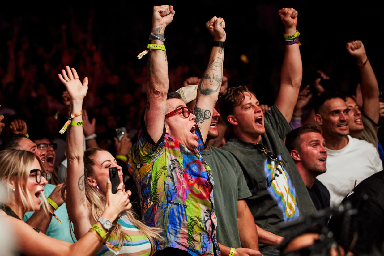 Famous fans including the NFL quarterback Joe Burrow cheer ringside at UFC 299, a mixed martial arts event in Miami, on March 9, 2024. (Scott McIntyre/The New York Times)