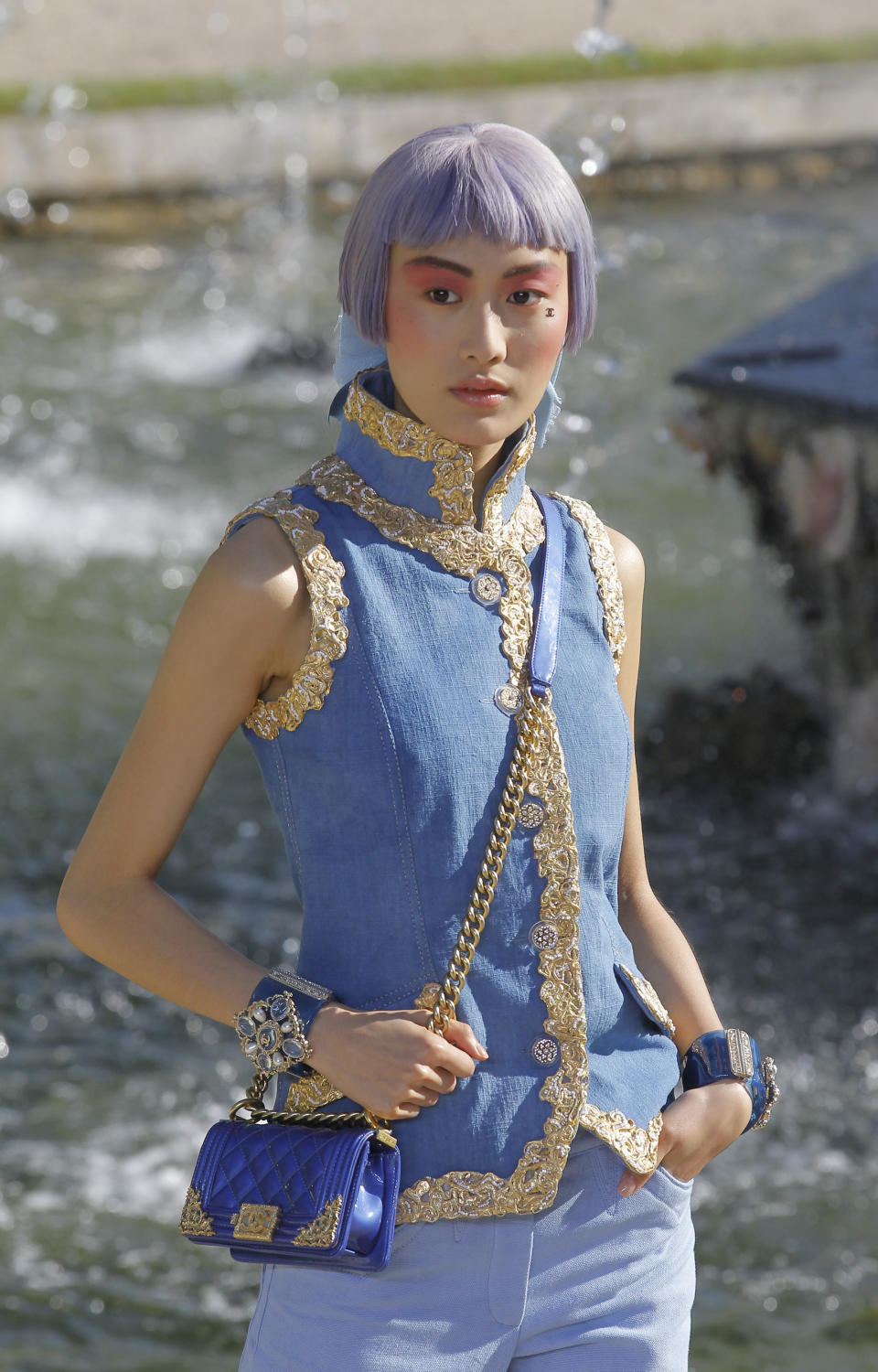 A model presents a creation by German fashion designer Karl lagerfeld for Chanel, Monday, May, 14, 2012. Master of Fashion, Karl Lagerfeld spares no expenses for his midseason Chanel Cruise show offering held at the former home of Marie Antoinette, the Chateau de Versailles, southwest of Paris. (AP Photo/Jacques Brinon)