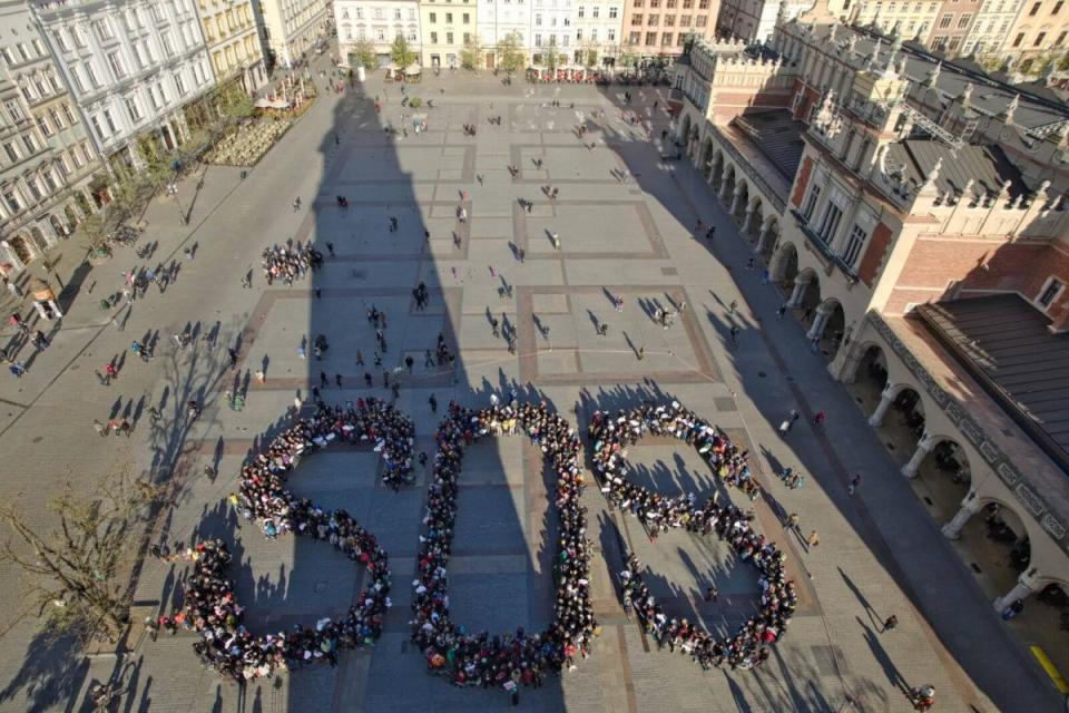 Members of Polish Smog Alert gather in an SOS formation in Krakow's main square (Polish Smog Alert)