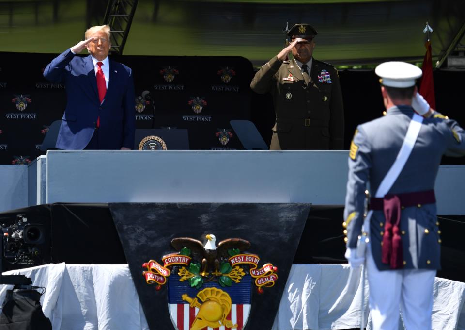 US President Donald Trump and Military Academy Superintendent Darryl Williams (R) salute cadets at the 2020 US Military Academy  graduation ceremony in West Point, New York, June 13, 2020. - Trump delivered the commencement address at the ceremony. (Photo by Nicholas Kamm / AFP) (Photo by NICHOLAS KAMM/AFP via Getty Images)