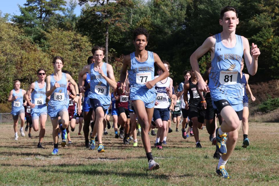 East Bridgewater's Nick Uzzo, right, won the boys race during the SSL Cross County Championships at Nichols Middle School in Middleboro on Sunday, Oct. 31, 2021.  