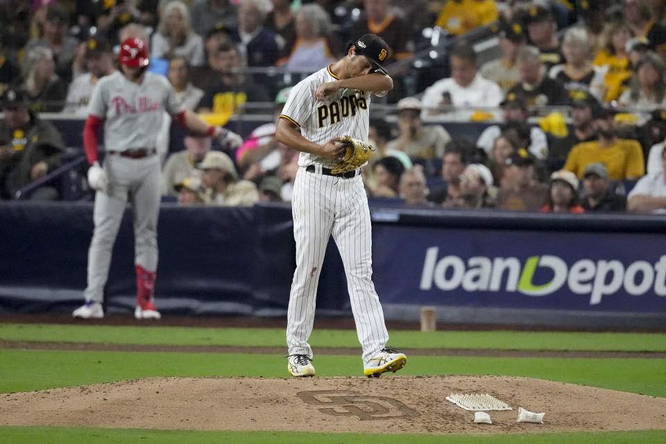 San Diego Padres starting pitcher Yu Darvish wipes his face wipes his during the seventh inning in Game 1 of the baseball NL Championship Series between the San Diego Padres and the Philadelphia Phillies on Tuesday, Oct. 18, 2022, in San Diego. (AP Photo/Ashley Landis)