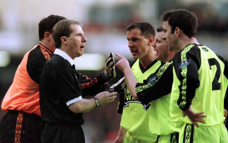 Sheffield United players complain to the referee after Arsenal's controversial goal