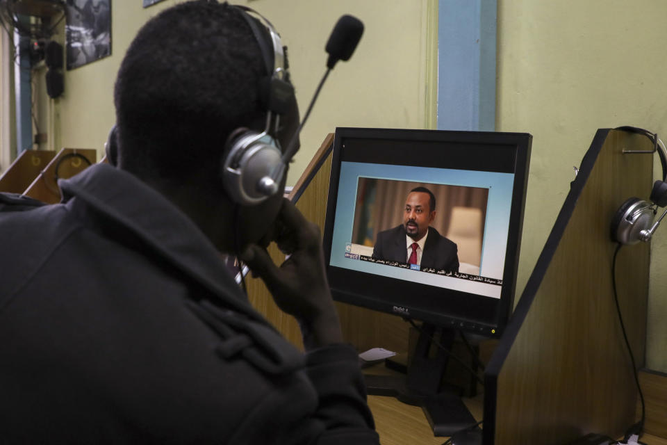 An Ethiopian streams a video of Prime Minister Abiy Ahmed speaking, at an internet cafe in the capital Addis Ababa, Ethiopia Thursday, Nov. 26, 2020. Ethiopia's prime minister said Thursday the army has been ordered to move on the embattled Tigray regional capital after his 72-hour ultimatum ended for Tigray leaders to surrender, and he warned the city's half-million residents to stay indoors and disarm. (AP Photo/Samuel Habtab)