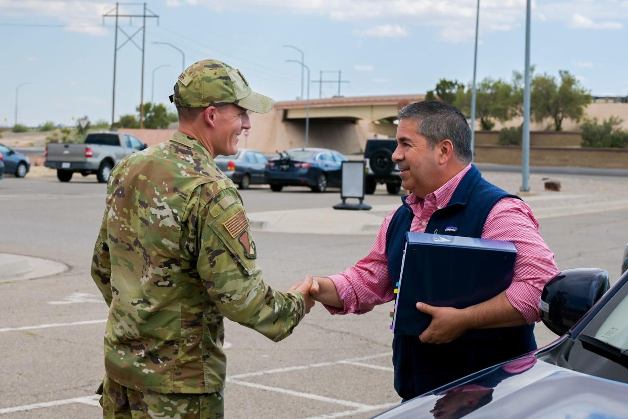 Col. Justin Spears, 49th Wing commander, greets Sen. Ben Ray Lujan as he arrives at Holloman Air Force Base, New Mexico, August 15, 2022. Lujan visited Holloman to learn about the 49th Wing and mission partner operations. (U.S. Air Force photo by Airman 1st Class Antonio Salfran)