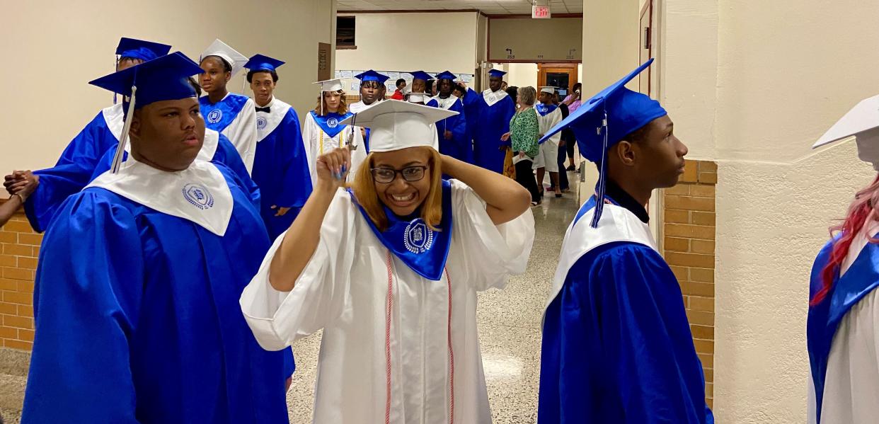 Bolton High School graduates line up to walk into the auditorium on Monday night. The 109th graduating class is the last one before the school undergoes a transformation into a pre-kindergarten through 12th-grade magnet.
