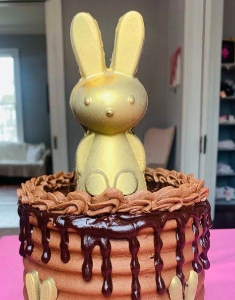 Dolce Darlin's Golden Chocolate Bunny Cake is a three-layer, 6-inch cake with rich chocolate frosting, ganache and chocolate Easter rabbits.