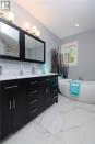 <p><span>57 Clear View Rd., Grand Barachois, N.B.</span><br> The master ensuite has a luxurious soaker tub. The home has four-and-a-half bathrooms.<br> (Photo: Zoocasa) </p>