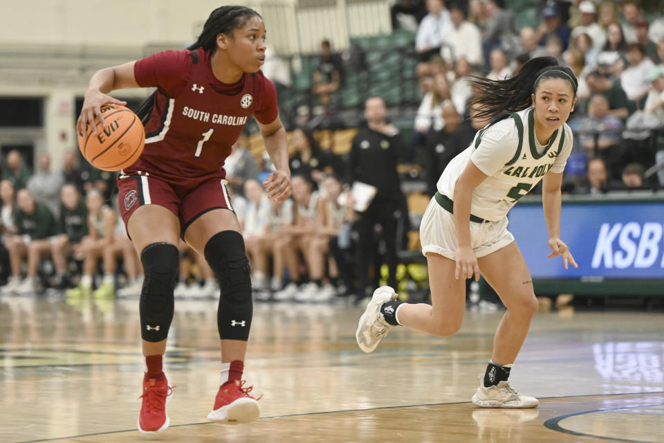 South Carolina guard Zia Cooke (1) dribbles down the court as Cal Poly guard Jazzy Anousinh watches in the second half of an NCAA college basketball game, Tuesday, Nov. 22, 2022, San Luis Obispo, Calif. (AP Photo/Nic Coury)