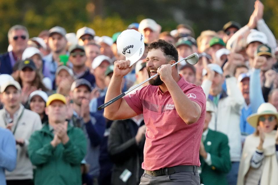 Jon Rahm reacts on the 18th green after winning The Masters.