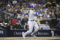 Los Angeles Dodgers' Justin Turner (10) hits an RBI single during the eighth inning of a baseball game against the San Diego Padres Wednesday, June 23, 2021, in San Diego. (AP Photo/Denis Poroy)