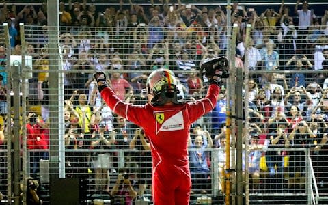 Sebastian Vettel soaks up the applause - Credit: EPA