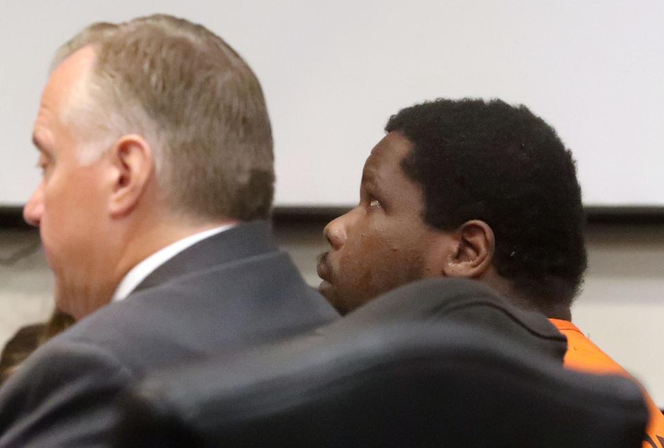 Jean Macean, the man accused of killing two people during Bike Week 2022, looks up at the courtroom ceiling while sitting with his defense team, Thursday, Nov. 2, 2023, during a competency hearing in Judge Elizabeth Blackburn's courtroom.