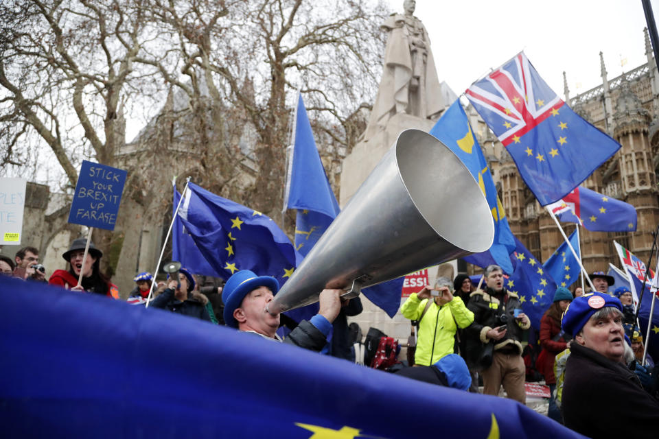 Pro-European demonstrators protest opposite the Houses of Parliament in London, Tuesday, Jan. 15, 2019. Britain's Prime Minister Theresa May is struggling to win support for her Brexit deal in Parliament. Lawmakers are due to vote on the agreement Tuesday, and all signs suggest they will reject it, adding uncertainty to Brexit less than three months before Britain is due to leave the EU on March 29. (AP Photo/Frank Augstein)