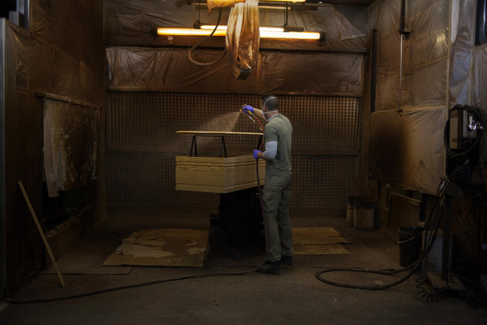 A coffin maker at the Eurocoffin coffins factory in Barcelona. (José Colon for Yahoo News)