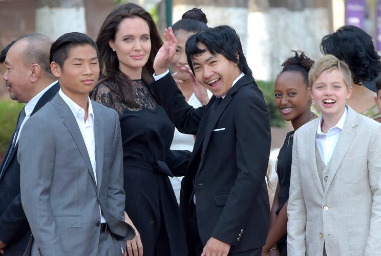 Angelina Jolie and her children meet with Cambodian King Norodom Sihamoni. (Photo: TANG CHHIN SOTHY/AFP/Getty Images)