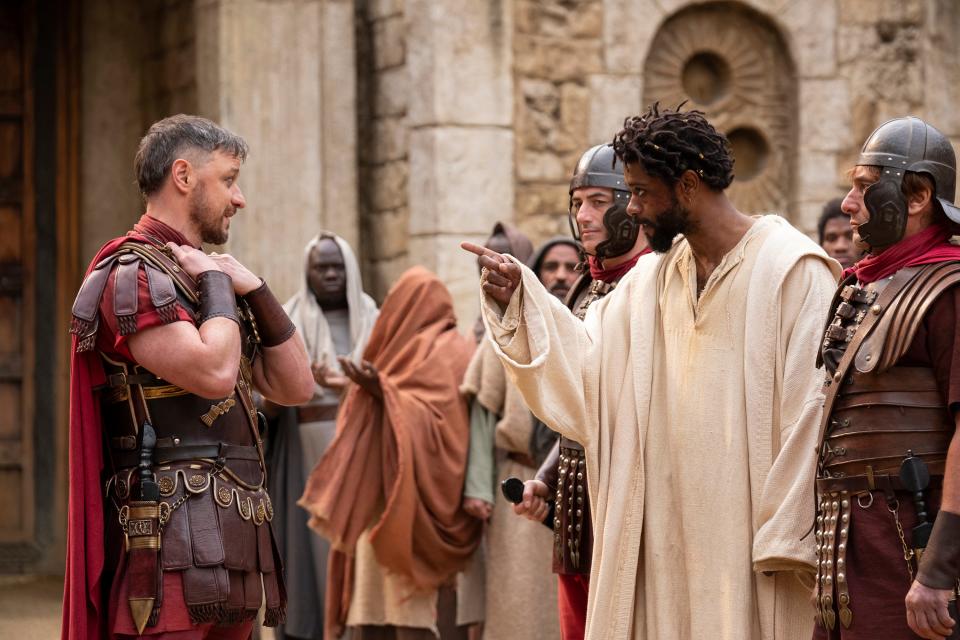 Pontius Pilate (James McAvoy, left) arrests Clarence (LaKeith Stanfield) when rounding up false messiahs in the biblical epic "The Book of Clarence."