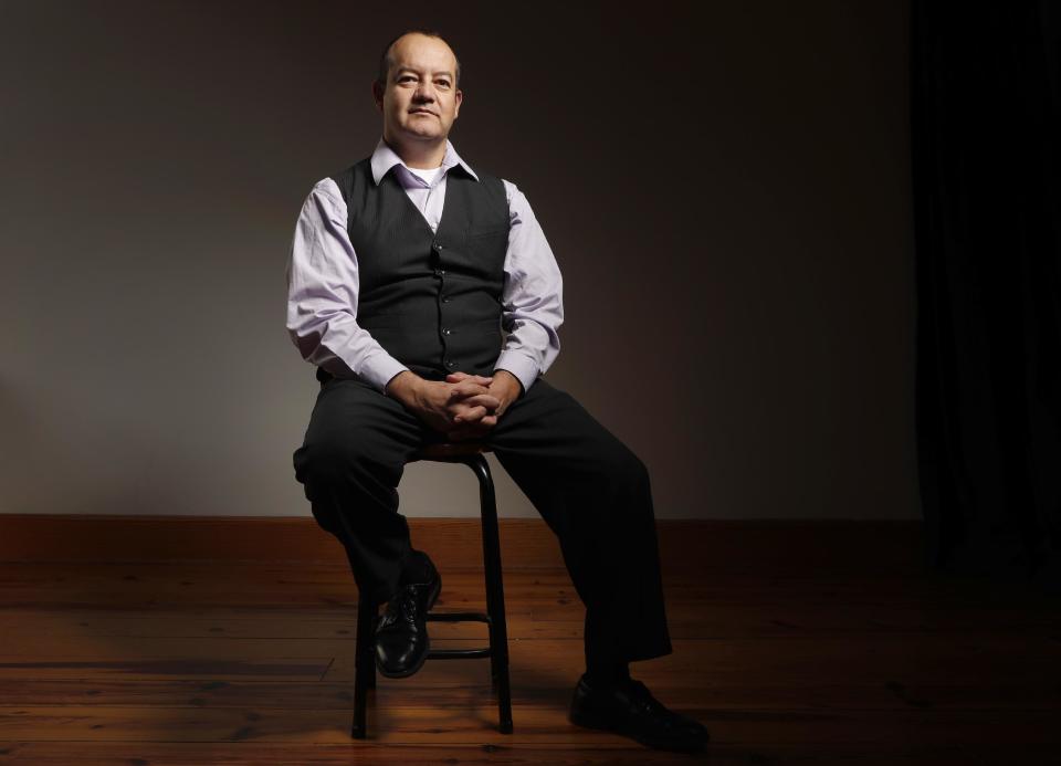 In this photo made Monday, Dec. 12, 2016, Hector Maldonado poses for a photo in St. Louis. Maldonado, a Mexican-American elector, says he’s sticking with his pledge to vote for Missouri’s winning candidate, Donald Trump. Missouri’s Hector Maldonado told The Associated Press he won’t change his vote Monday despite emails and letters pressuring him to change his mind. (AP Photo/Jeff Roberson)