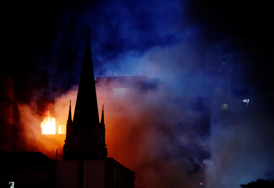 Burning high-rise collapses