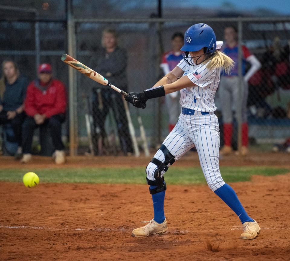 Brett Watson (1) puts the ball in play during the Pace vs Jay softball game at Jay High School on Thursday, March 24, 2022.