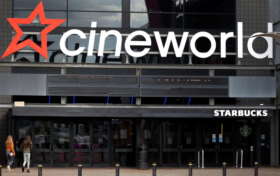 People enter a Cineworld cinema following the outbreak of the coronavirus disease (COVID-19) near Manchester, Britain, October 4, 2020. REUTERS/Phil Noble