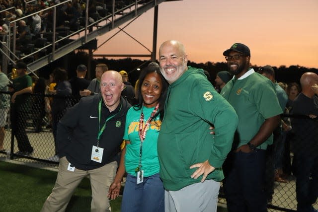 Mark Harden, right, started working as the athletic director at Sycamore High School in 2019.