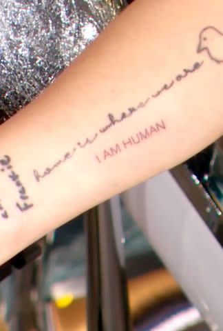 <p>The Drew Barrymore Show/TikTok</p> Drew Barrymore's "I Am Human" tattoo